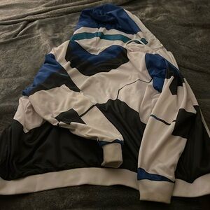 Jacket. Size small/medium. Little wear and tear on sleeves (no holes)